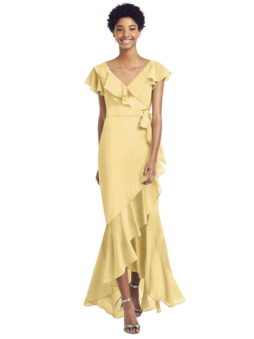 Model wearing pastel yellow bridesmaid dress with ruffles and tied waistline