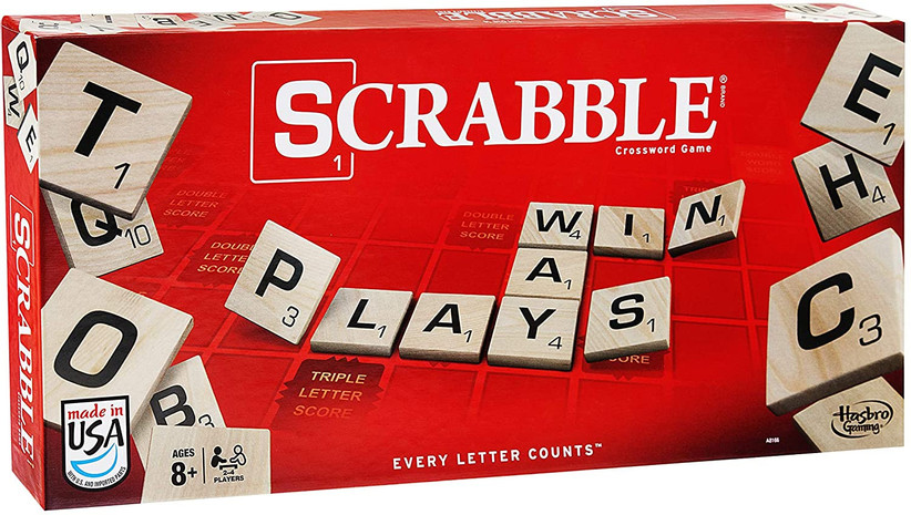 Red Scrabble board game cover shower some of the letter tiles