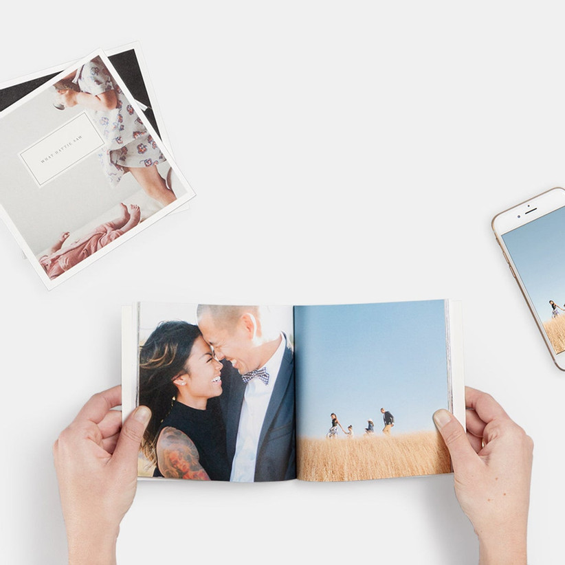 Photo book showing picture of a happy couple and outdoor family photo