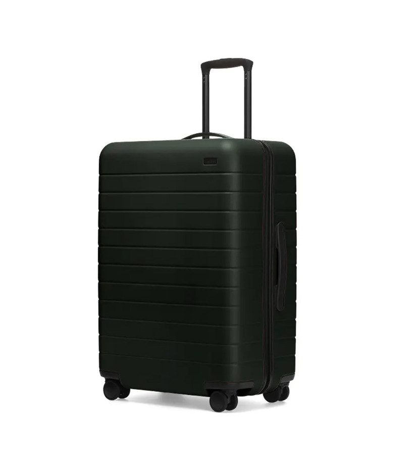green rolling suitcase