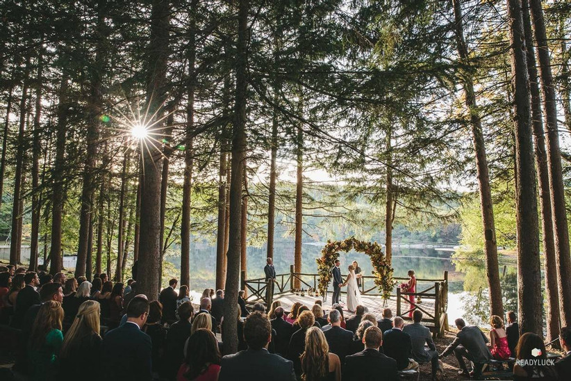 wedding ceremony in the woods overlooking the lake