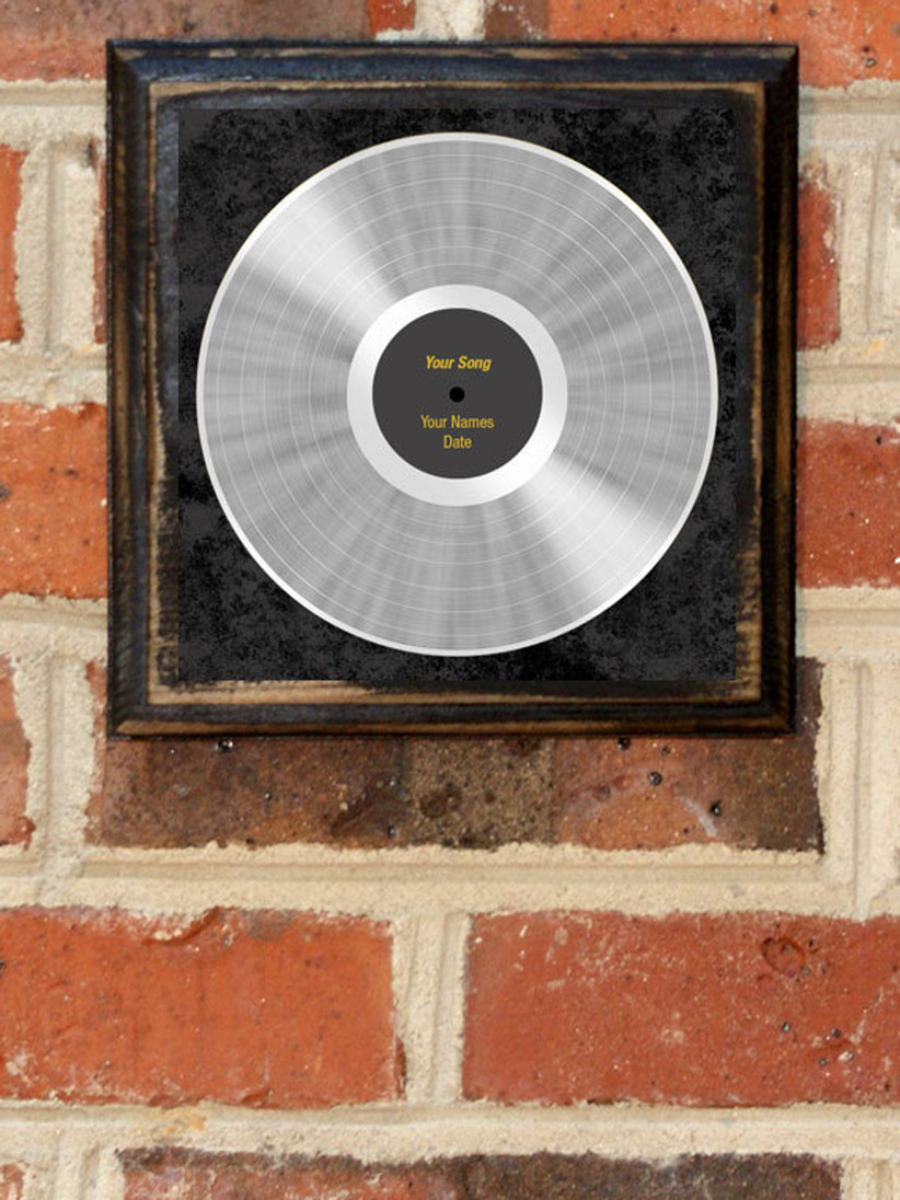platinum record personalized print hanging on brick wall