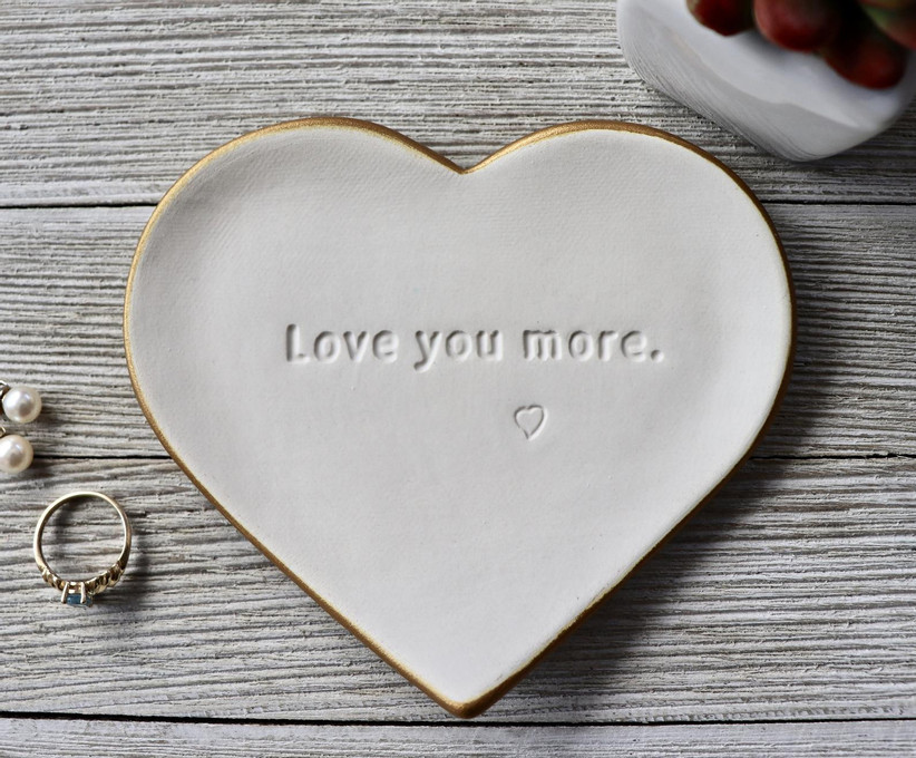 White heart-shaped trinket dish stamped with Love You More