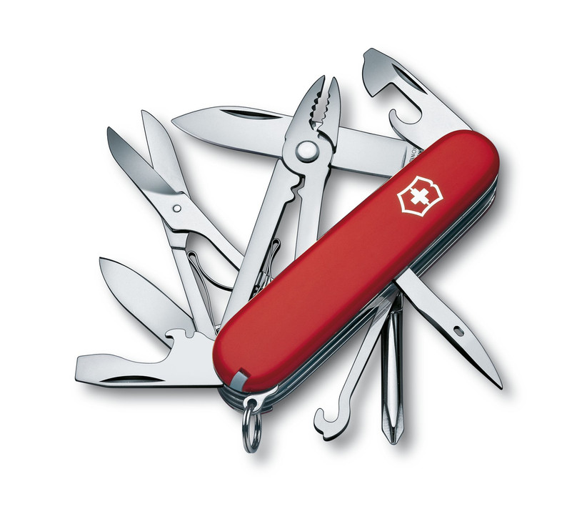Red Swiss army knife with a variety of tools on display