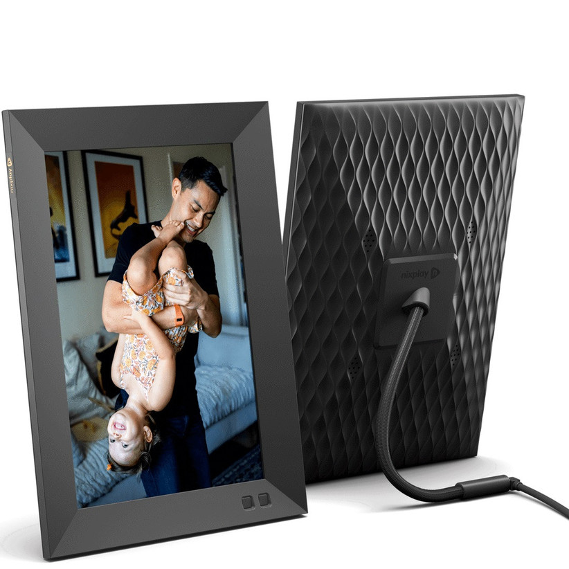 Black digital photo frame with textured design on the back showing photo of father and child playing