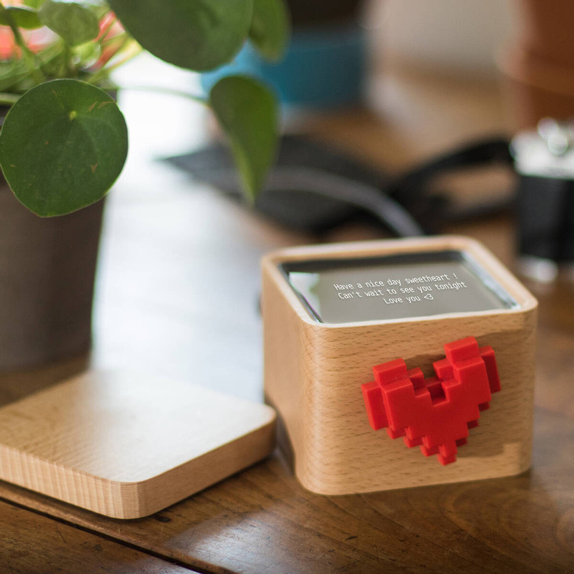 Small wooden box with spinning red heart on the front and message display on the top with lid