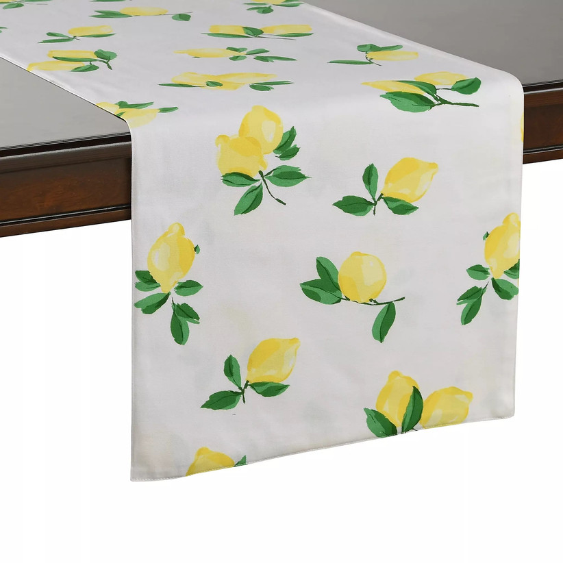 White tablecloth draped over table with lemon pattern