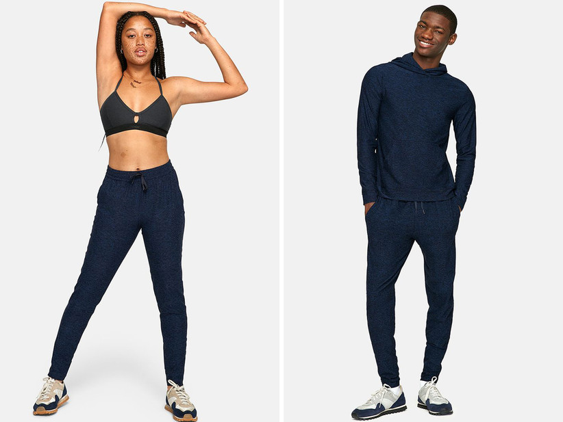 Collage of models from left to right: woman wearing bra and navy sweatpants, man wearing navy sweatpants and matching hoodie