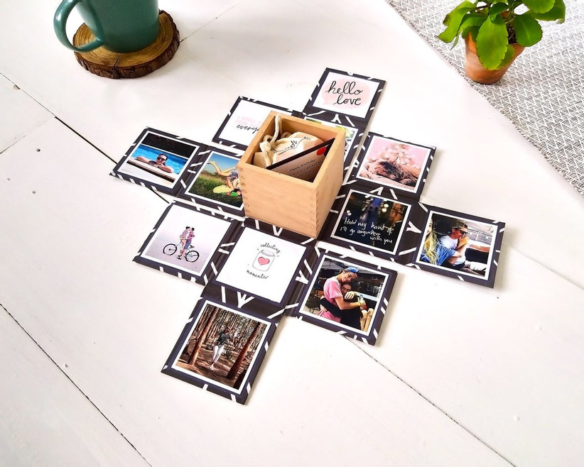 Small gift box that folds out to reveal tiny gift and magnetic photo display
