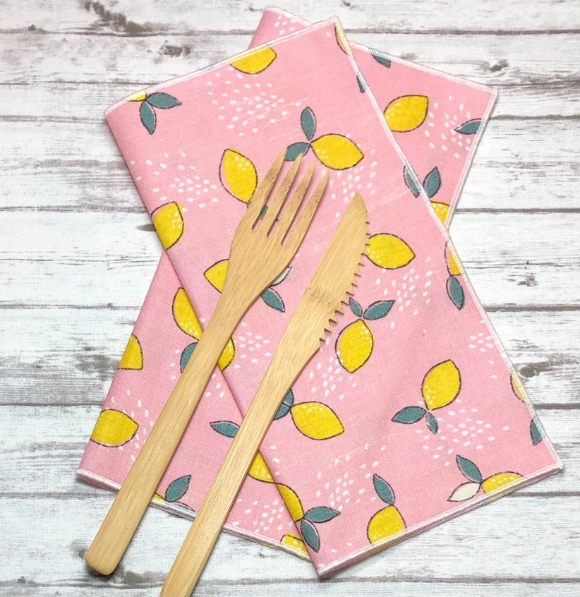 Pink cloth table napkins with cute lemon print