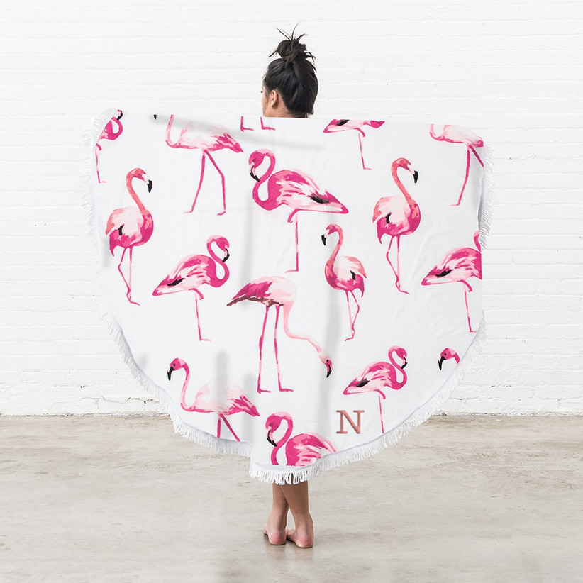 White and pink flamingo print beach towel embroidered with the letter N bachelorette party decor