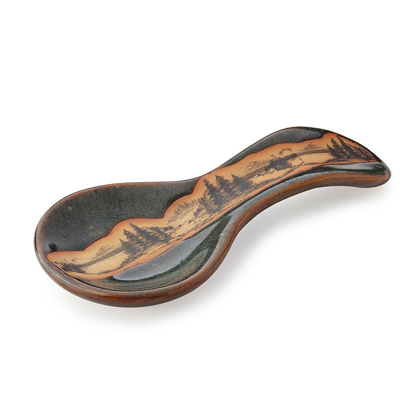 Black stoneware spoon rest with mountain scene across the middle