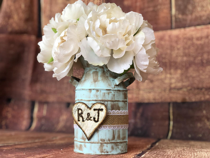 Rustic distressed blue mason jar with custom initial heart, jute ribbon, and white flowers