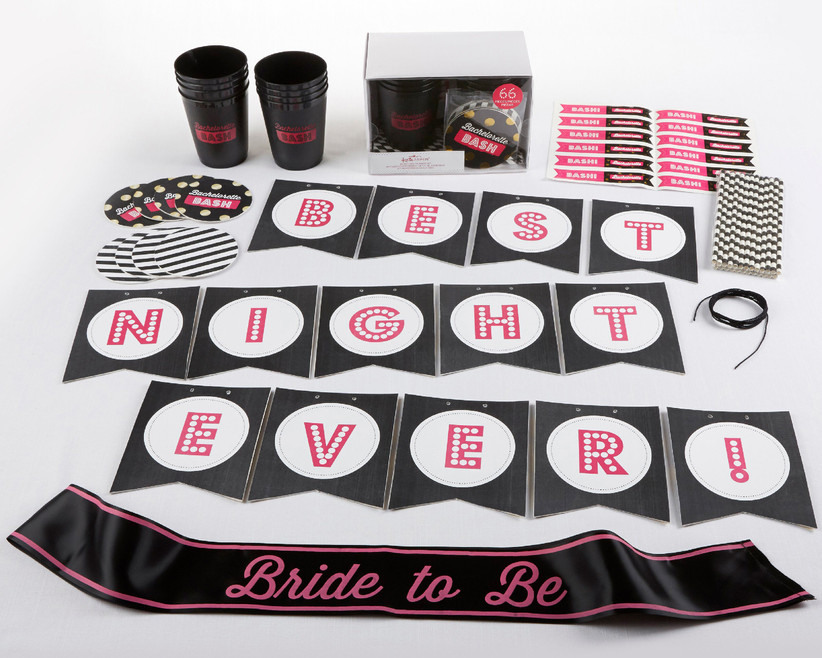 Set of black and pink bachelorette party decorations including a sash, banner, cups, coasters, and more