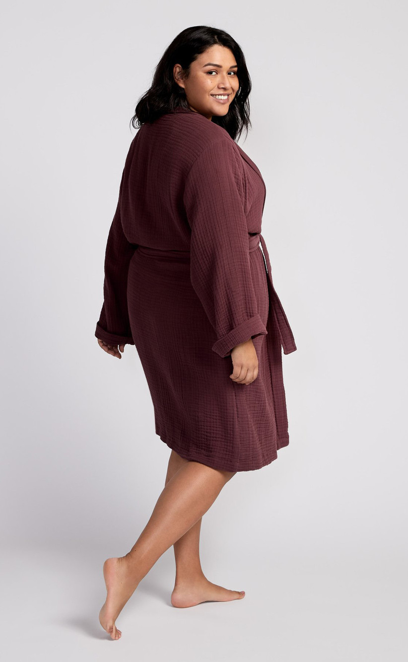 Plus-size model wearing comfy cotton robe in mulberry hue