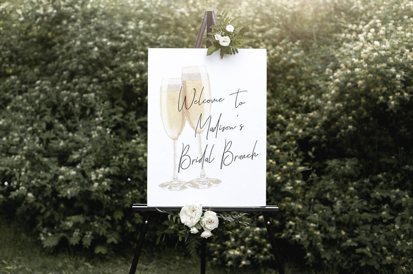 Elegant welcome sign on black easel that reads Welcome to Madison's Bridal Brunch
