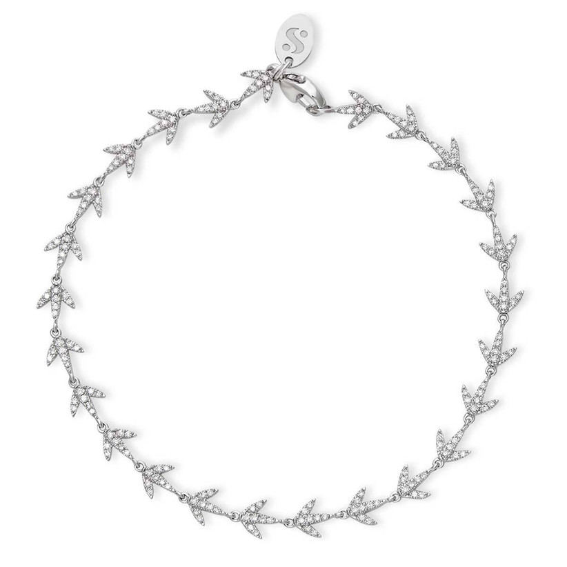Dainty diamond path bracelet on gray background
