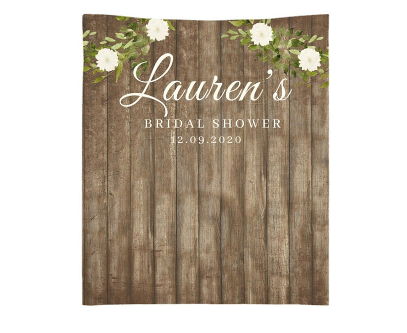 Rustic faux bois backdrop on a white background that reads Lauren's Bridal Shower