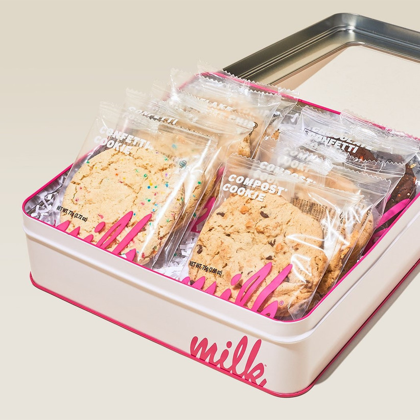 Milk Bar white and pink tin full of separately packaged cookies