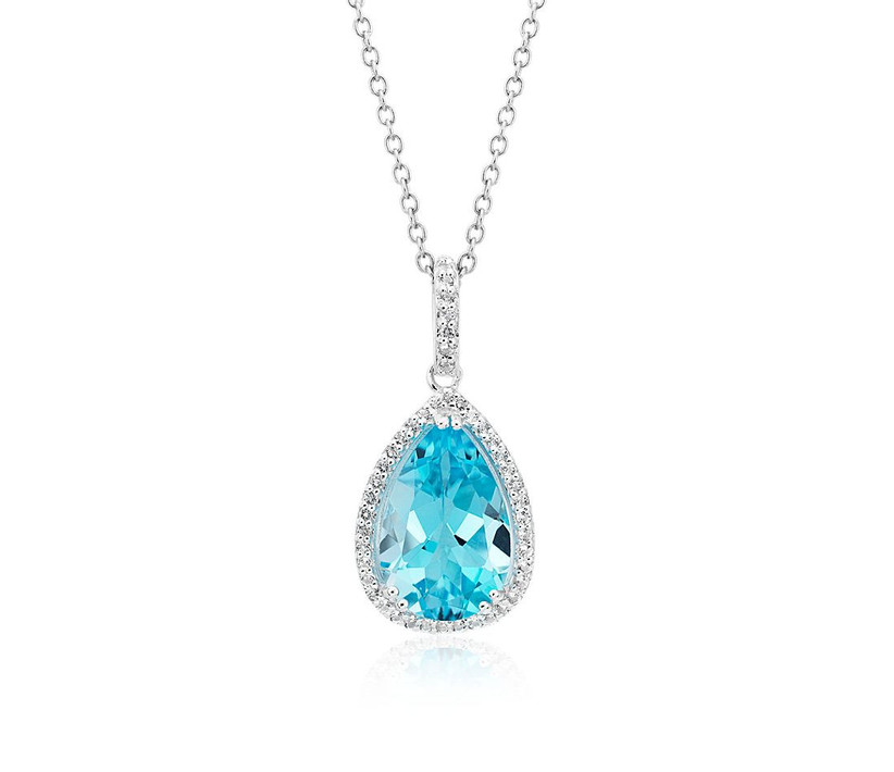 pear shaped blue topaz pendant surrounded by diamonds