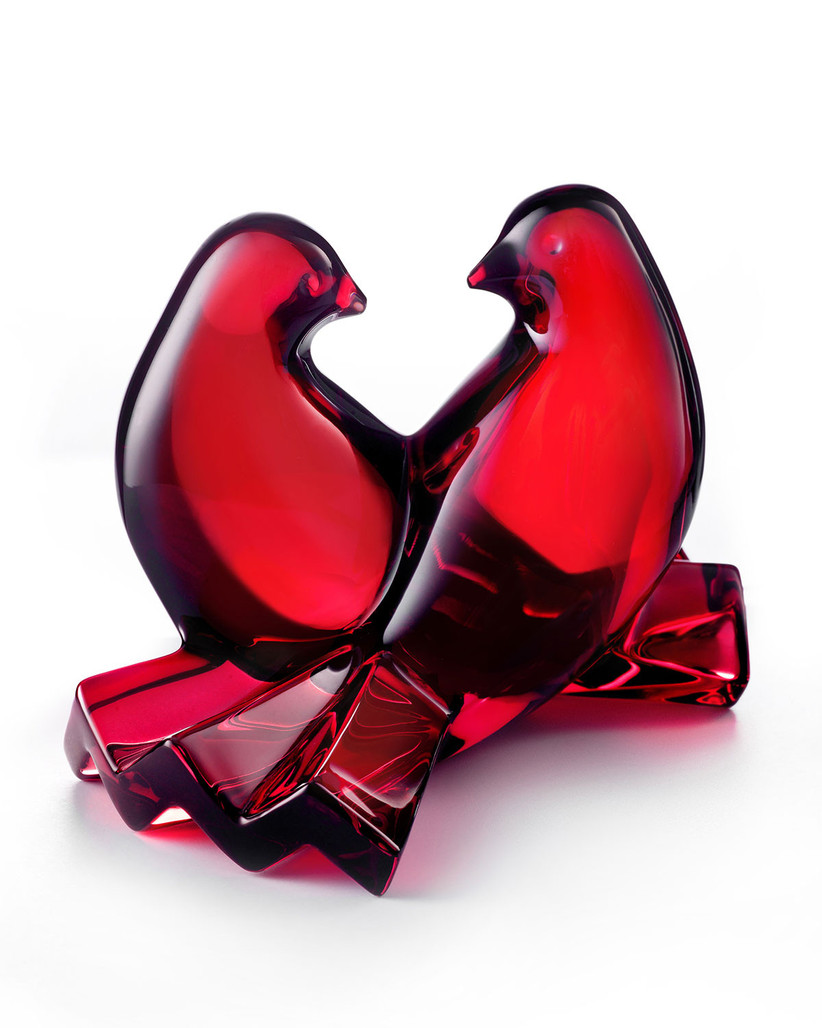 a pair of red glass doves