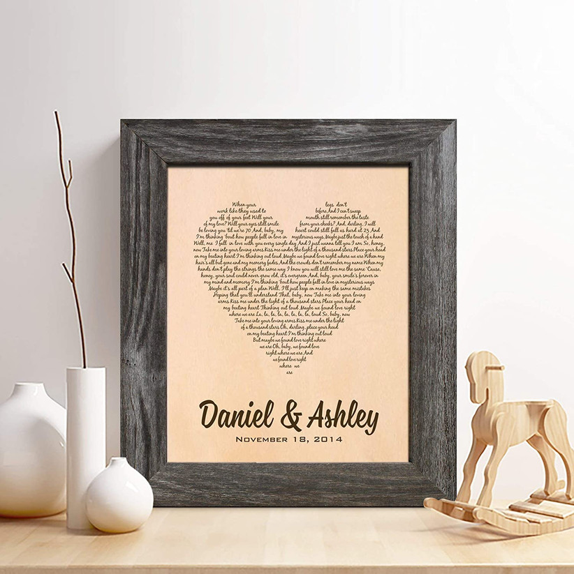 framed leather print with couple's names and song lyrics in the shape of a heart