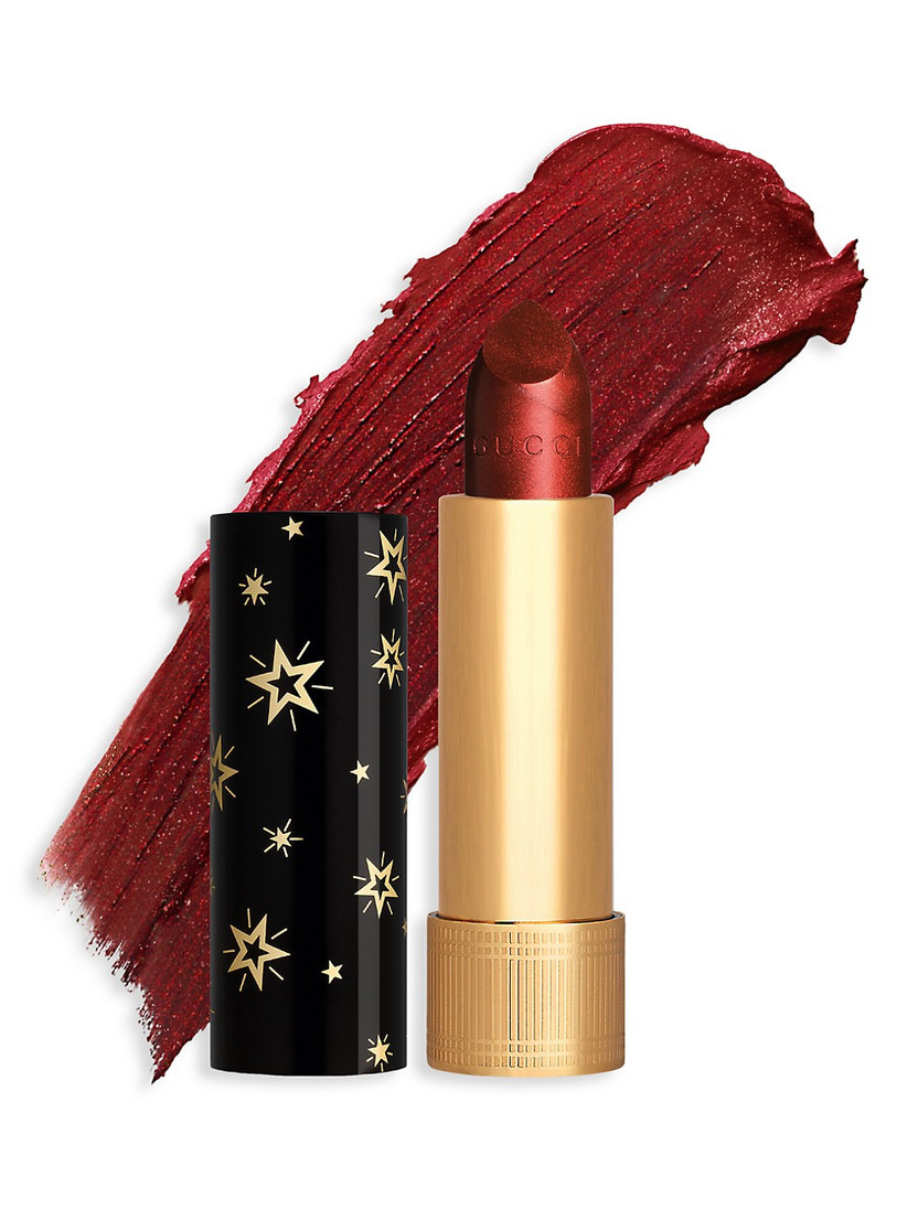 a gold tube of sparkly red lipstick by gucci