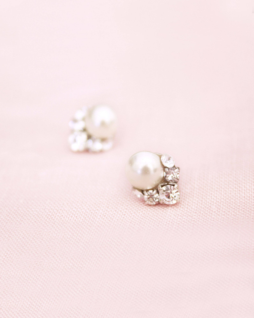 pearl and crystal cluster earrings on pink backdrop