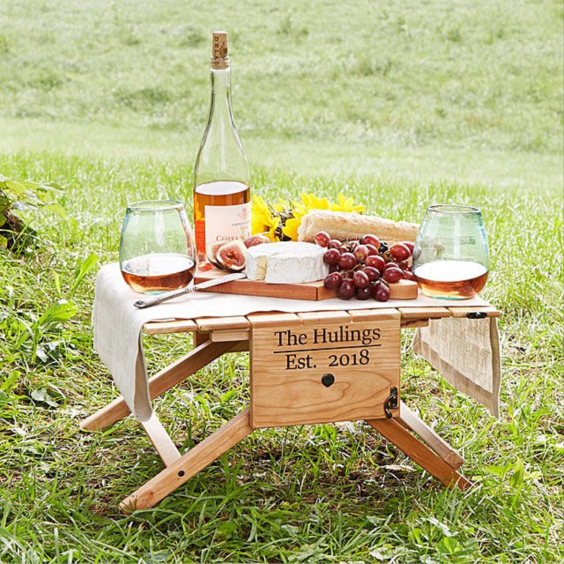 personalized wooden picnic table with food on top