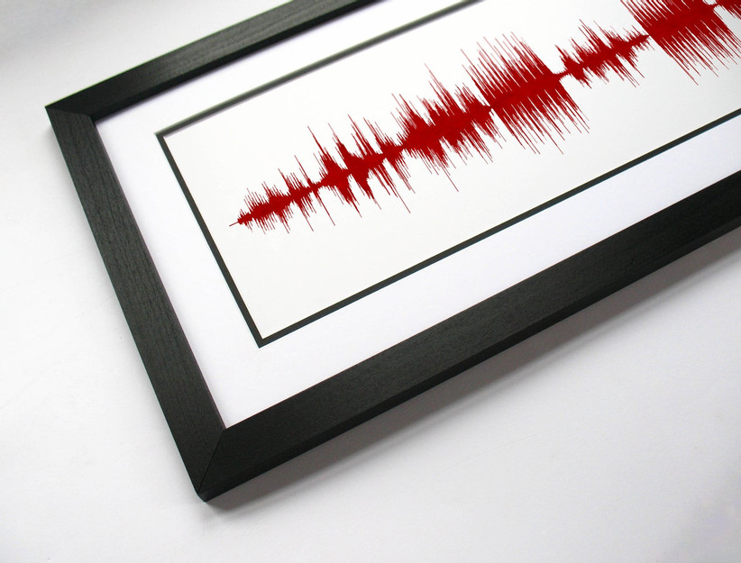 framed red soundwave print on white background