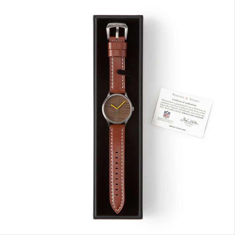 watch with brown leather strap in black case