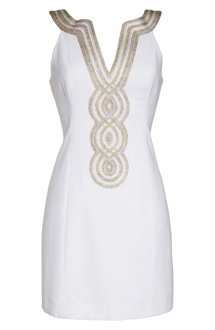 short white engagement party dress with metallic gold embroidery at necline
