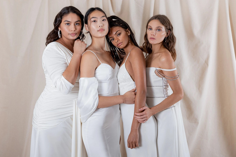 Four models wearing various dresses from Katharine Polk's bridal collection