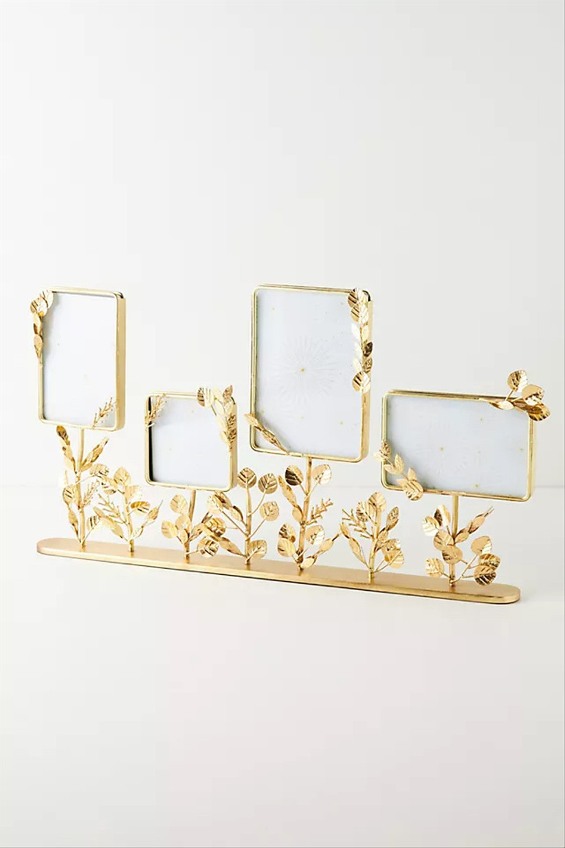 набор из четырех золотых рамок для картин, украшенных проволочными листьями